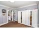 Bright bedroom with mirrored closets, providing ample storage and creating a spacious and airy atmosphere at 404 E 1St St, Cherryville, NC 28021