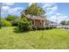 Cozy brick home featuring a lovely lawn, mature trees, and a convenient carport in a desirable location at 404 E 1St St, Cherryville, NC 28021