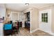 Bright laundry room with dining table, natural light, closet washer and dryer, and access to the backyard at 404 E 1St St, Cherryville, NC 28021