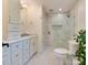 Elegant bathroom with marble walk-in shower and white vanity at 4216 Maureen Dr, Charlotte, NC 28205