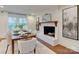 Bright dining area featuring a fireplace, modern decor, and natural light at 4216 Maureen Dr, Charlotte, NC 28205