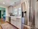 Lovely kitchen showcasing stainless steel appliances, an apron sink, and sleek cabinetry at 4216 Maureen Dr, Charlotte, NC 28205