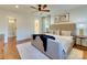 Bright bedroom with view of a walk-in closet and an ensuite bathroom featuring hardwood floors at 4216 Maureen Dr, Charlotte, NC 28205