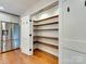 Pantry with custom shelving adjacent to the kitchen at 4216 Maureen Dr, Charlotte, NC 28205