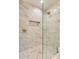 Beautiful walk-in shower featuring marble tiling, a built-in niche, and glass door at 4216 Maureen Dr, Charlotte, NC 28205