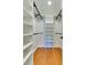 A well-organized walk-in closet offers ample storage with shelving and rods at 4216 Maureen Dr, Charlotte, NC 28205