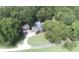 Extensive grounds showing brick home with in-ground pool, lush greenery, detached garage, and long driveway at 4436 Roberta Rd, Concord, NC 28027