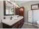 Bathroom featuring double sinks, a spacious vanity, and elegant lighting, providing a spa-like experience at 4436 Roberta Rd, Concord, NC 28027