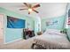 Bedroom featuring light blue walls, unique decor, ceiling fan, and natural light at 4436 Roberta Rd, Concord, NC 28027