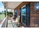 Inviting front porch with rocking chairs and brick exterior offering a cozy outdoor space at 4436 Roberta Rd, Concord, NC 28027