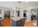 Open kitchen showcasing an island with granite countertops and a view of the dining and living areas at 4436 Roberta Rd, Concord, NC 28027