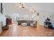 Spacious living room with vaulted ceilings, skylights, ceiling fans and wood-look flooring at 4436 Roberta Rd, Concord, NC 28027