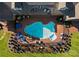 Aerial view of the backyard pool, patio, and lush landscaping at 49461 River Run Rd, Albemarle, NC 28001