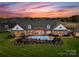 Stunning aerial view of a luxurious estate, featuring a pool and lush greenery, perfect for outdoor enjoyment at 49461 River Run Rd, Albemarle, NC 28001