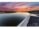 Enjoy relaxing water views from this deck featuring a white railing and dark floor at 49461 River Run Rd, Albemarle, NC 28001