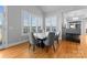 Chic dining area with a modern table, comfortable seating, and large windows with natural light at 49461 River Run Rd, Albemarle, NC 28001