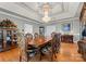 Formal dining room features a large wooden table, decorative chairs, and a chandelier at 49461 River Run Rd, Albemarle, NC 28001