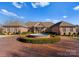 Circular driveway and fountain lead to this stunning residence with manicured landscaping at 49461 River Run Rd, Albemarle, NC 28001