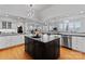 Elegant kitchen showcases a black island, stainless steel appliances, and ample counter space at 49461 River Run Rd, Albemarle, NC 28001