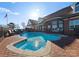 An inviting in-ground pool and hot tub with a brick surround is a perfect place to relax at 49461 River Run Rd, Albemarle, NC 28001