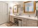 Elegant bathroom with double vanity, framed mirrors, and ample cabinet space at 514 Saint Johns Dr, Salisbury, NC 28144