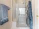 Bathroom featuring a modern shower with glass doors, a built-in seat, and sleek fixtures for a spa-like experience at 514 Saint Johns Dr, Salisbury, NC 28144