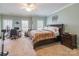 Tranquil bedroom featuring plush carpet, a ceiling fan, and a comfortable bed with bedside tables at 514 Saint Johns Dr, Salisbury, NC 28144