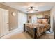 Cozy bedroom featuring a well-appointed bed, ceiling fan, neutral walls, and a window with natural light at 514 Saint Johns Dr, Salisbury, NC 28144