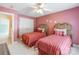 Inviting bedroom with twin beds features matching linens and a large window with natural light, creating a comfortable space at 514 Saint Johns Dr, Salisbury, NC 28144