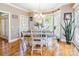 Inviting dining room with natural light, chandelier, and a wood table with upholstered chairs at 514 Saint Johns Dr, Salisbury, NC 28144