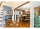 An elegant dining room features hardwood floors, decorative columns, and a stylish chandelier at 514 Saint Johns Dr, Salisbury, NC 28144