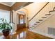 Inviting foyer with hardwood floors, a staircase, and a decorative front door with sidelights at 514 Saint Johns Dr, Salisbury, NC 28144