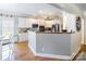 Bright kitchen with white cabinets, stainless steel appliances, and hardwood floors at 514 Saint Johns Dr, Salisbury, NC 28144