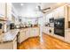 Bright kitchen with white cabinetry, stainless steel appliances, and hardwood floors at 514 Saint Johns Dr, Salisbury, NC 28144