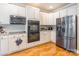 Modern kitchen featuring stainless steel appliances, double ovens, and granite countertops at 514 Saint Johns Dr, Salisbury, NC 28144