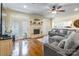 Cozy living room with hardwood floors, a fireplace, and French doors offering natural light at 514 Saint Johns Dr, Salisbury, NC 28144