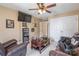 Cozy living area with a ceiling fan, tv, and comfortable leather furniture at 514 Saint Johns Dr, Salisbury, NC 28144