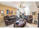 Spacious living room featuring comfortable leather furniture and a ceiling fan at 514 Saint Johns Dr, Salisbury, NC 28144