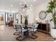 Dining area featuring modern lighting, stylish furniture, and view to the kitchen at 5731 Castlerea Dr, Charlotte, NC 28217