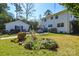 Large yard with a deck, trees, and grass at 5943 Charing Pl, Charlotte, NC 28211