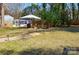 Backyard with an outdoor seating area and fire pit at 5943 Charing Pl, Charlotte, NC 28211