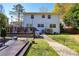 View of the home's exterior showing the deck and lawn at 5943 Charing Pl, Charlotte, NC 28211