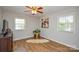 Cozy bedroom featuring neutral walls, hardwood floors, and natural light, creating a relaxing atmosphere at 5943 Charing Pl, Charlotte, NC 28211