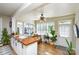 Sunlit dining area featuring a butcher block counter and large windows at 5943 Charing Pl, Charlotte, NC 28211