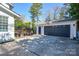 View of the detached garage from the backyard, including the basketball net at 5943 Charing Pl, Charlotte, NC 28211