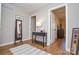 Charming hallway featuring hardwood floors, stylish decor, and neutral paint, creating a warm welcome at 5943 Charing Pl, Charlotte, NC 28211