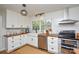 Modern kitchen with white subway tile backsplash, stainless steel appliances, and ample cabinet space at 5943 Charing Pl, Charlotte, NC 28211