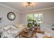 Bright living room with hardwood floors, natural light, and neutral decor, creating a serene and inviting space at 5943 Charing Pl, Charlotte, NC 28211