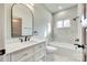 This bathroom features white tiling, a large mirror, and modern fixtures for a luxurious feel at 7 Private St, York, SC 29745