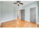 Stylish bedroom featuring hardwood floors with a view into an ensuite bathroom and closet at 7 Private St, York, SC 29745